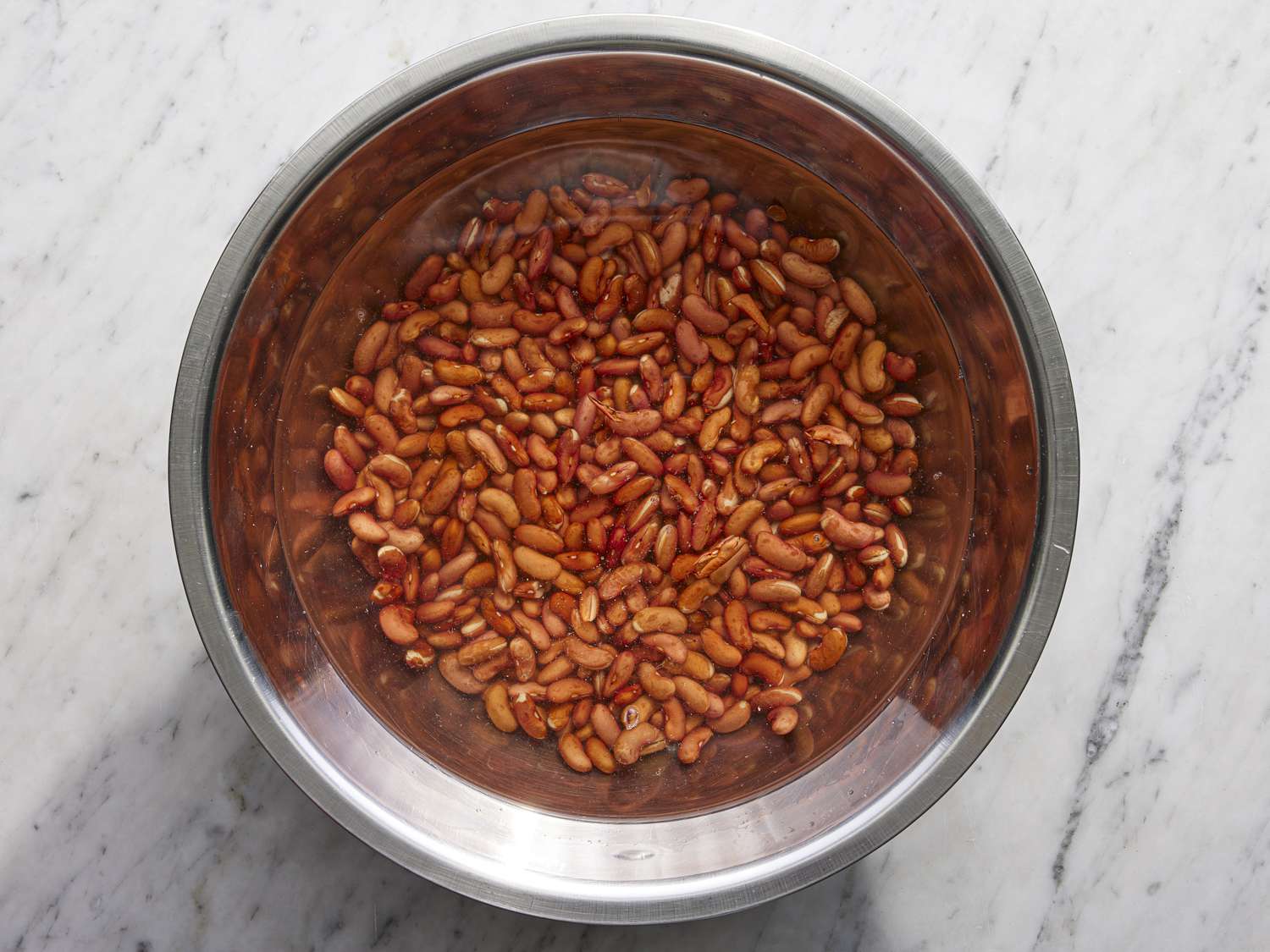 Overhead view of beans soaked in water