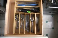 the umilife organizer in a drawer with utensils