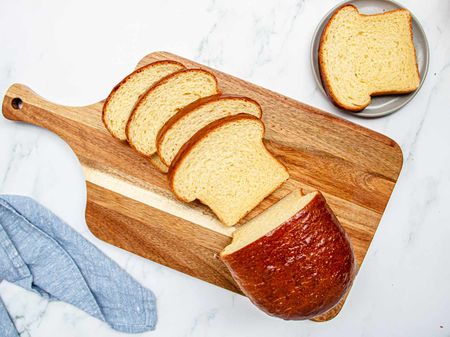 Overhead view of sliced brioche loaf