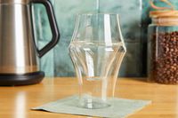 A Kruve coffee cup on a kitchen countertop.