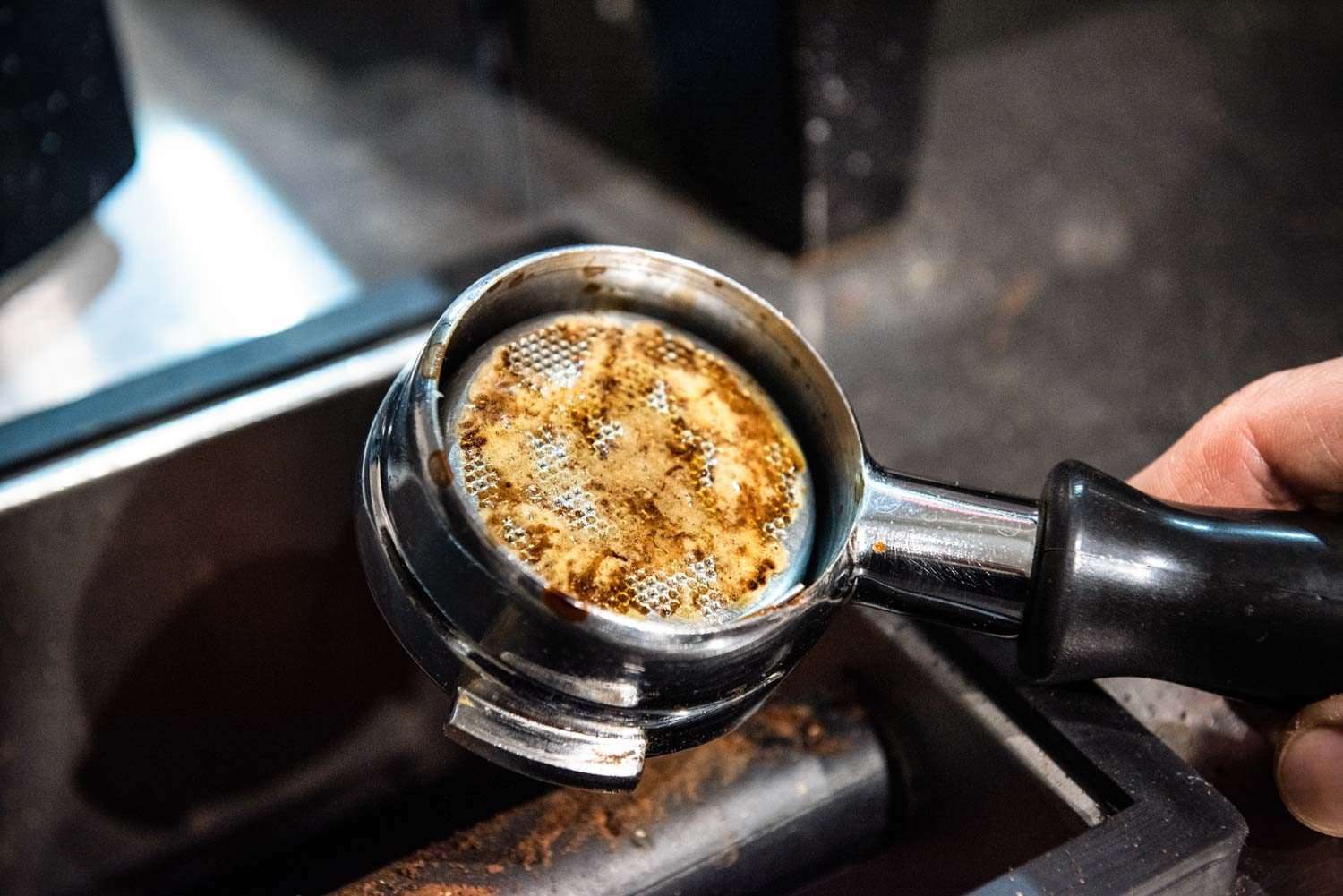 Clogged espresso portafilter due to too-fine coffee grounds