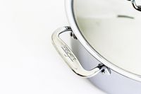 A close up of the handle of a pot from the All-Clad D3 3-Ply Stainless Steel Cookware Set 10 Piece