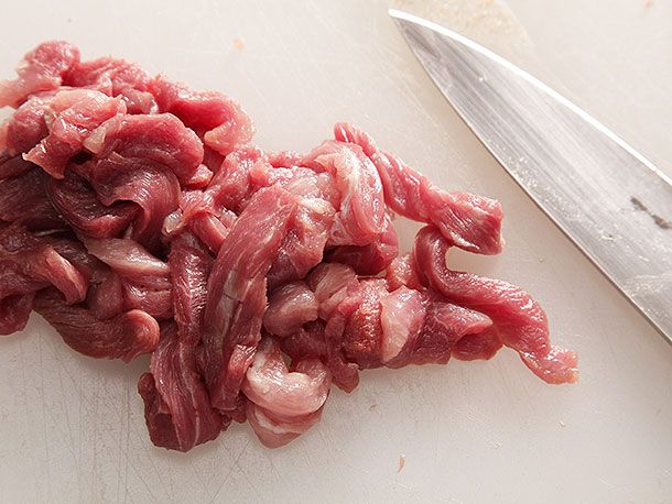 Raw pork sliced into strips.