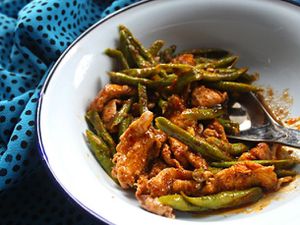 Enjoying a red curry chicken stir-fry with green beans.