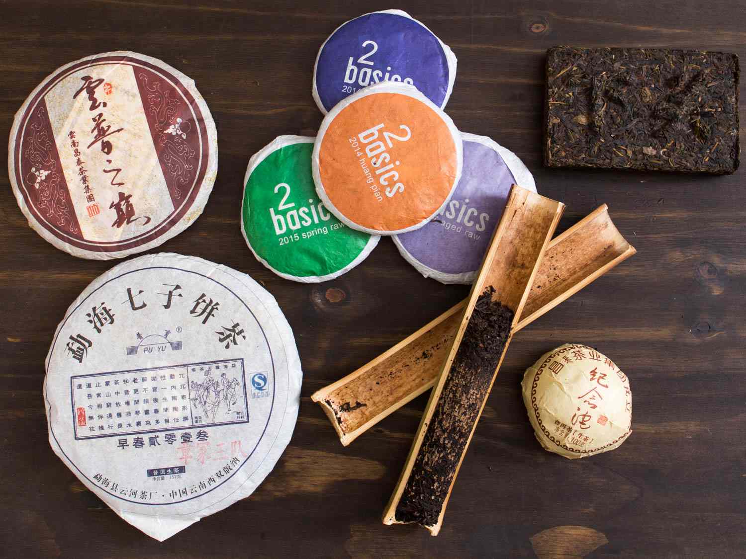 Overhead closeup of different types of pu-erh tea in different packaging 