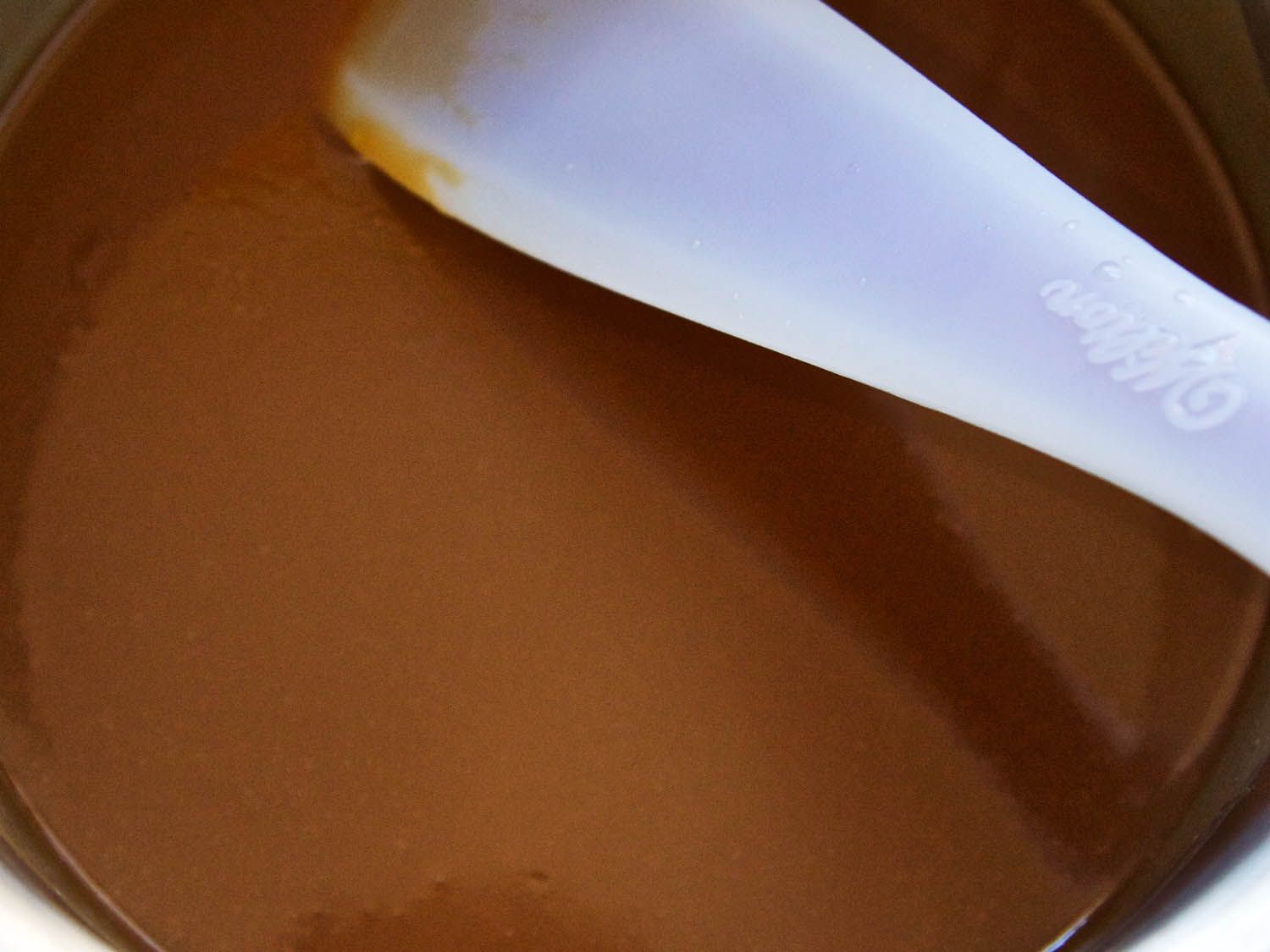 Close up of a smooth caramel sauce. 