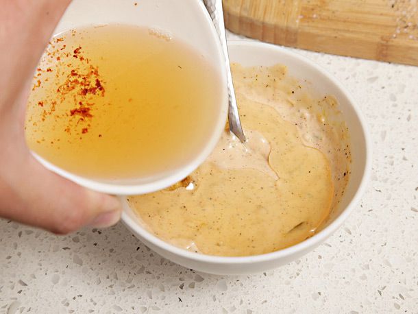 Adding bacon grease to a sauce.