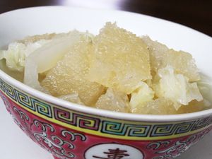 Closeup of pork skin soup in a small bowl.