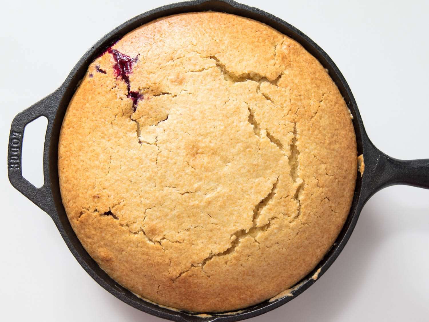 Overhead view of the finished muffin in the skillet, fresh from the oven.