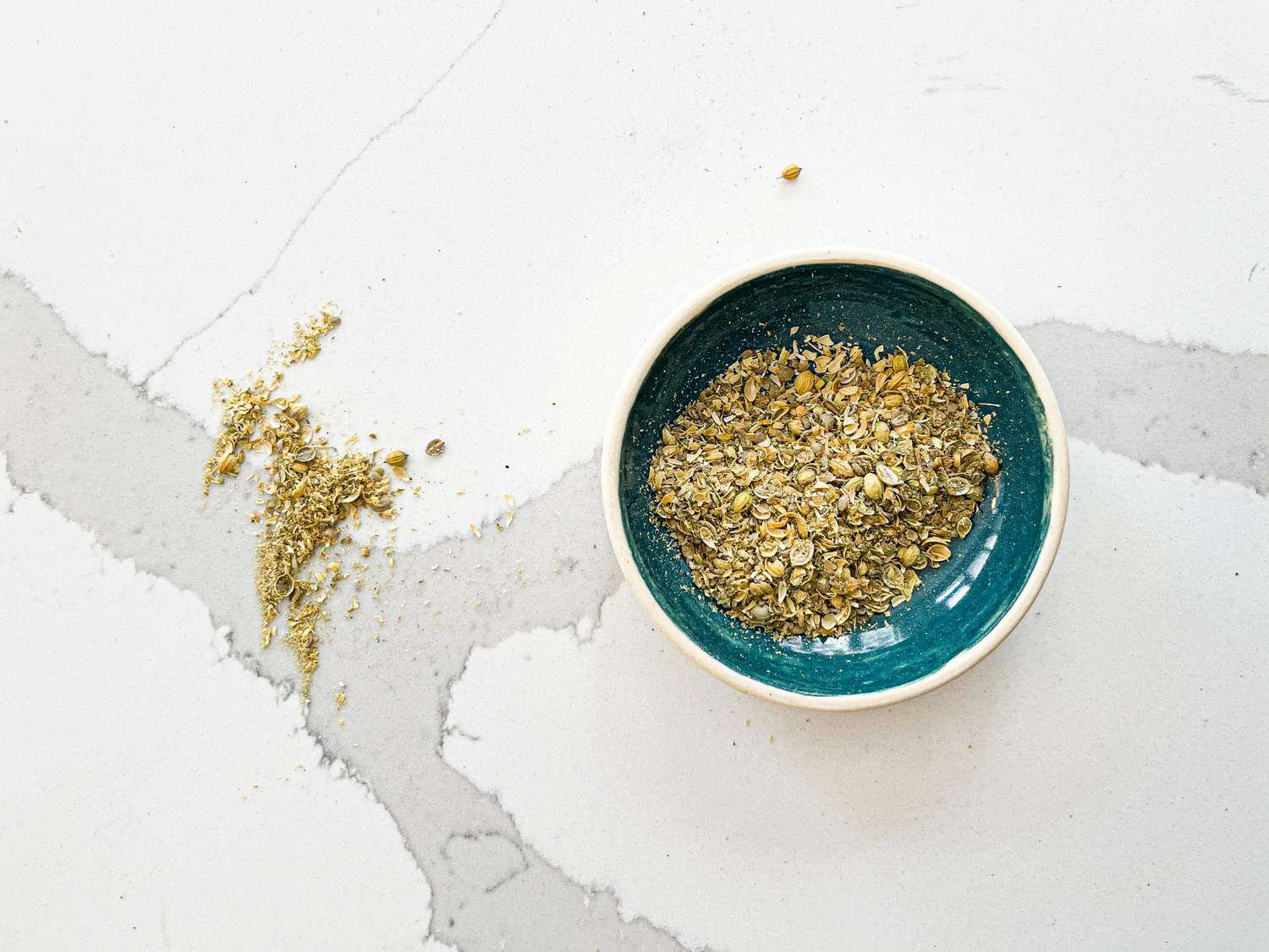A bowl of partially ground coriander 