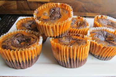 Pumpkin Swirl Brownies arranged on a white platter.