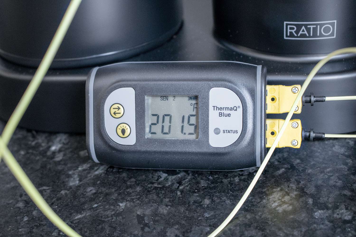 A thermocouple taking the temperature of the showerhead during brewing