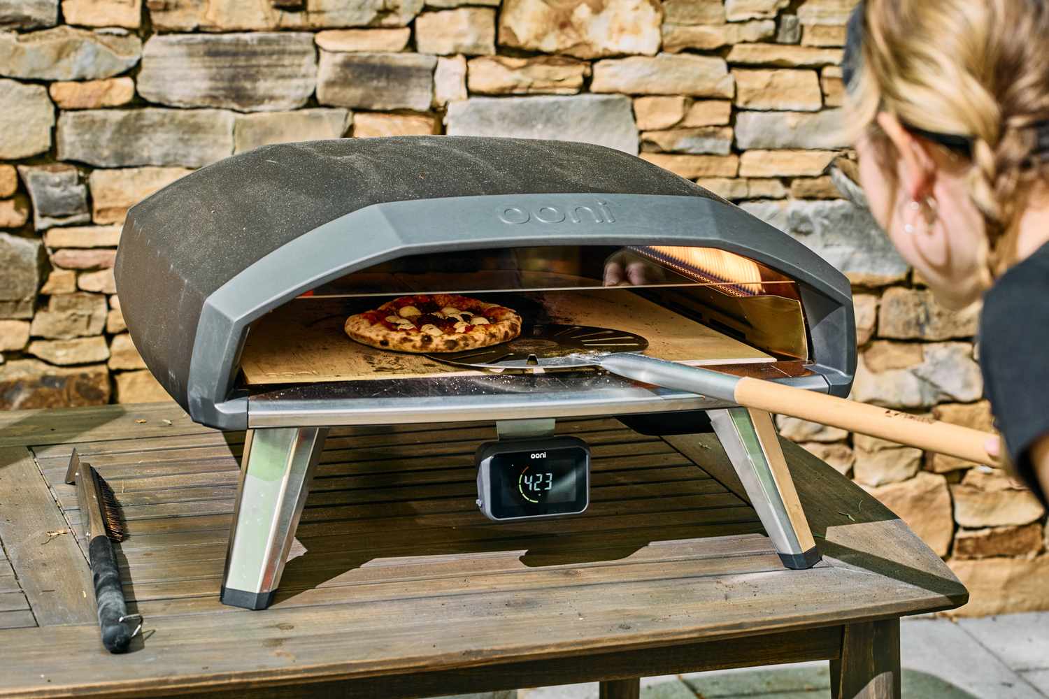 A pizza is cooked in the Ooni Koda 2 Pro Gas-Powered Pizza Oven