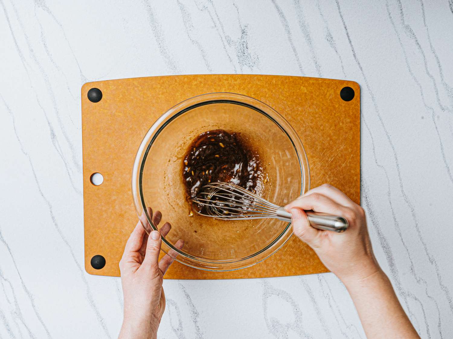 Overhead view of whisking marinade 