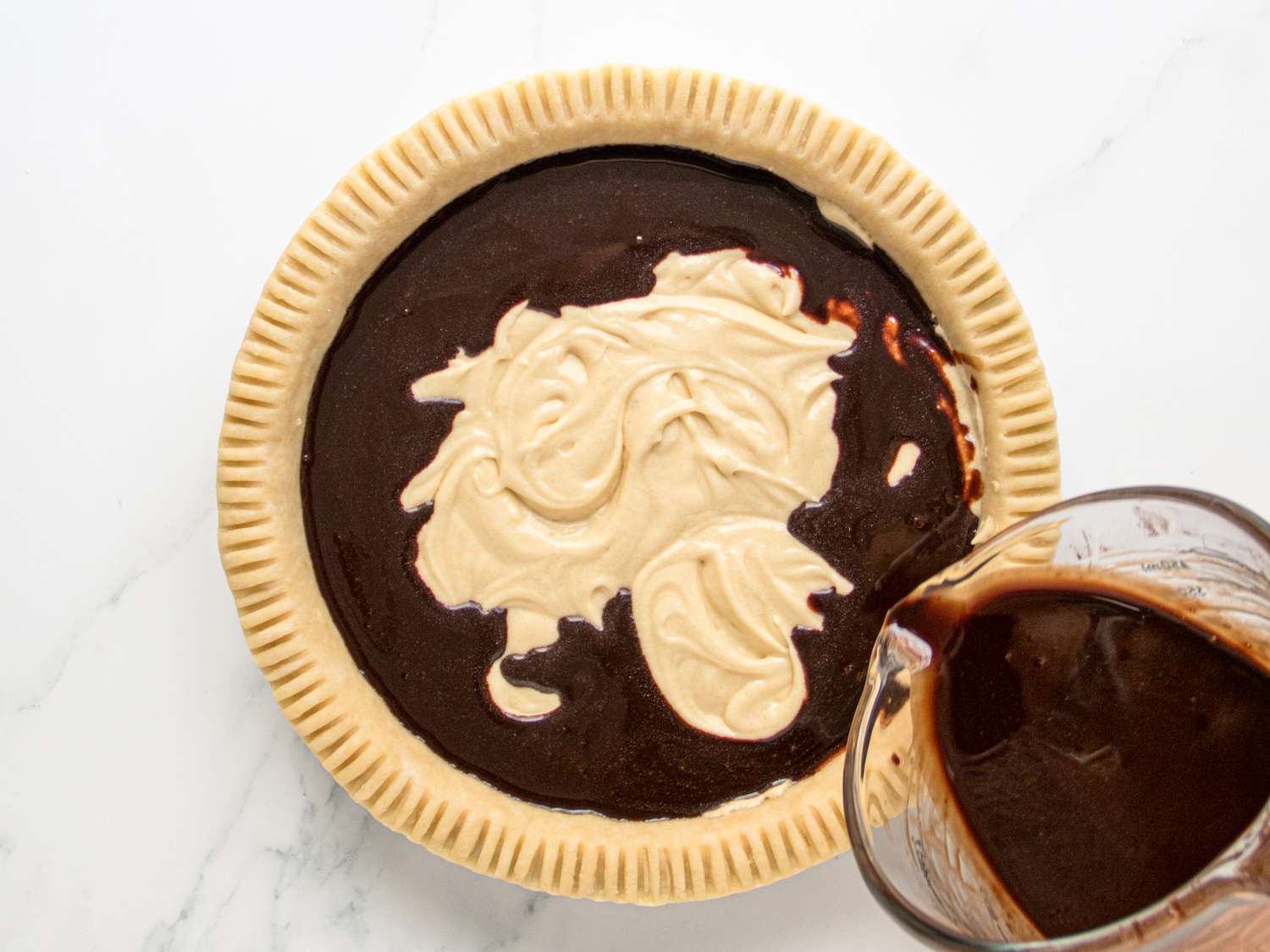 Chocolate mixture pouring into batter