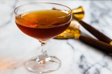 A 100-year-old cigar cocktail, served in a chilled coupe glass.