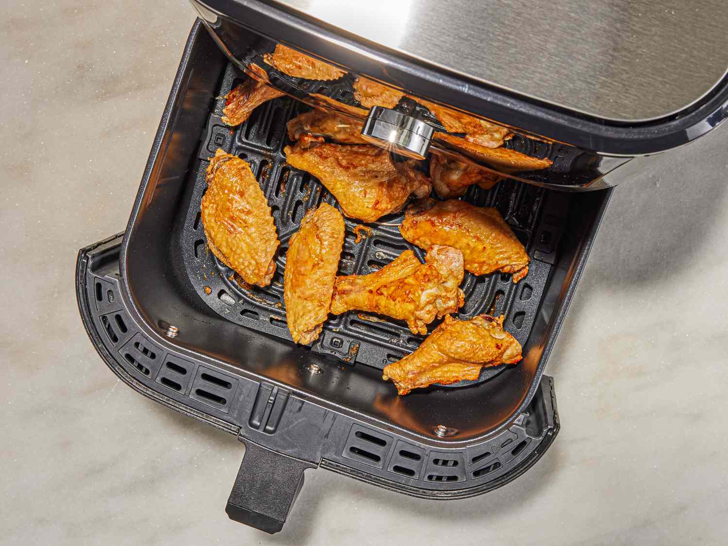 Overhead view of wings cooked in air fryer