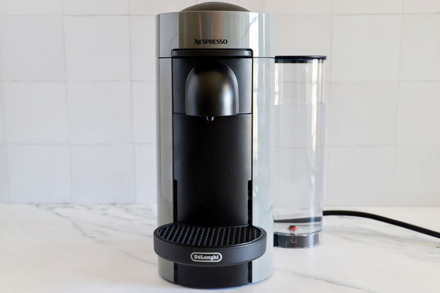 The Nespresso VertuoPlus Coffee and Espresso Machine by De'Longhi on a kitchen counter