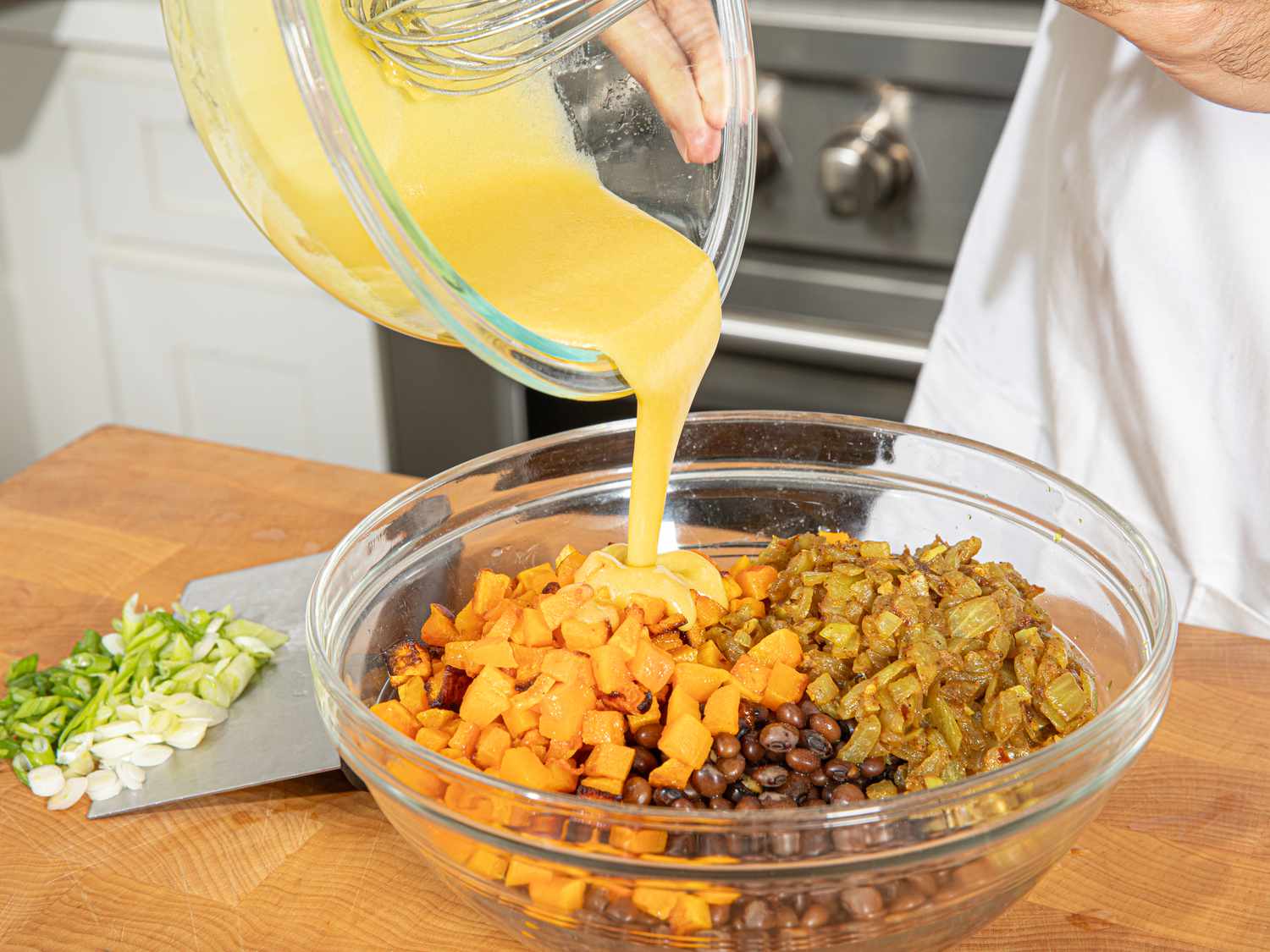 Adding dressing to dish