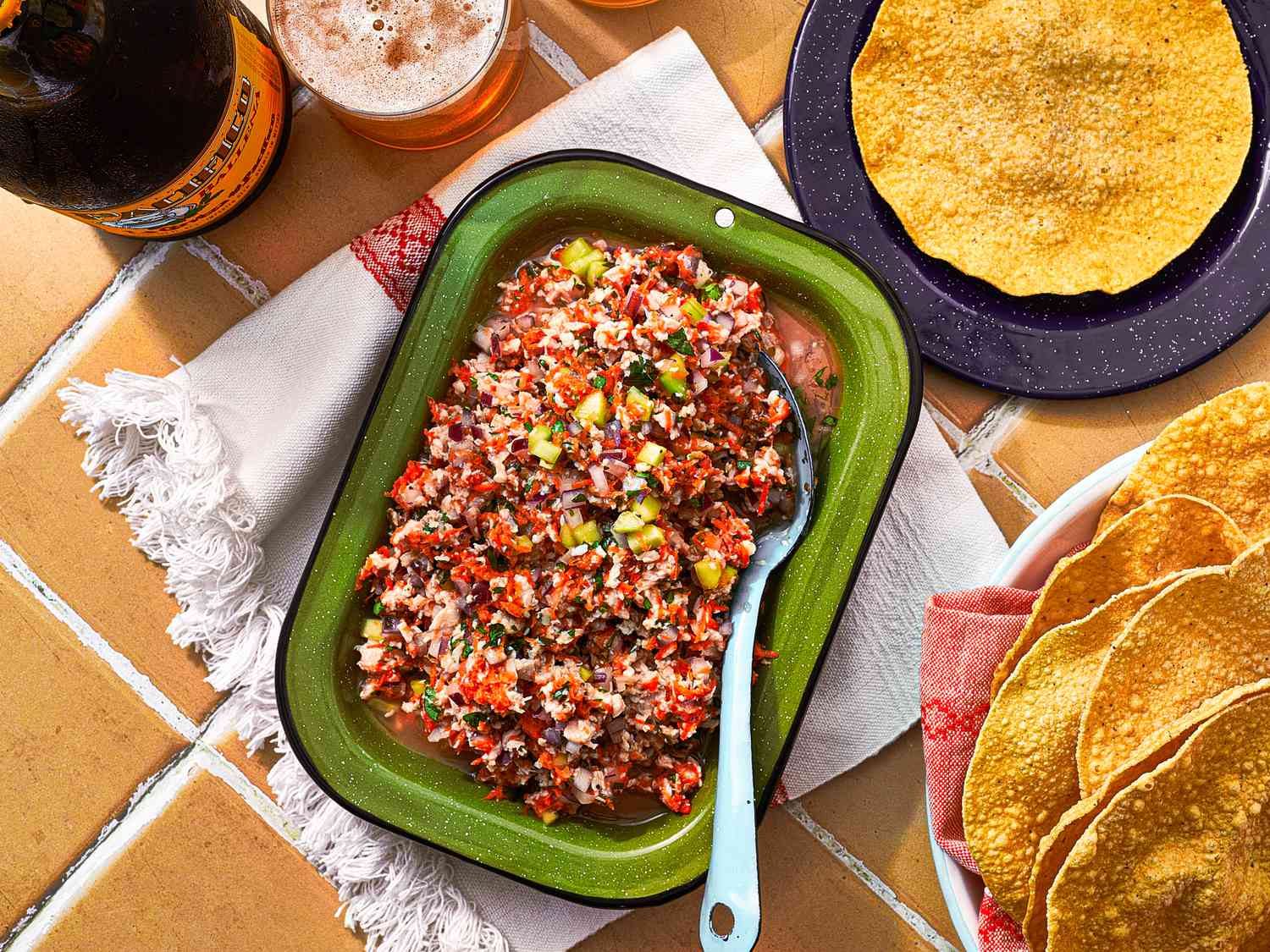 Overhead view of ceviche in a serving dish with tostadas 