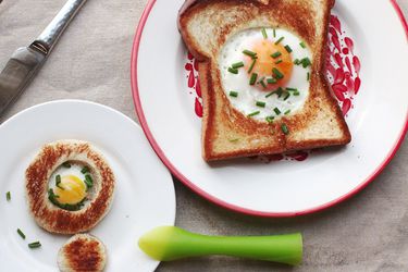 A full-size and tiny version of egg-in-a-hole plated side by side