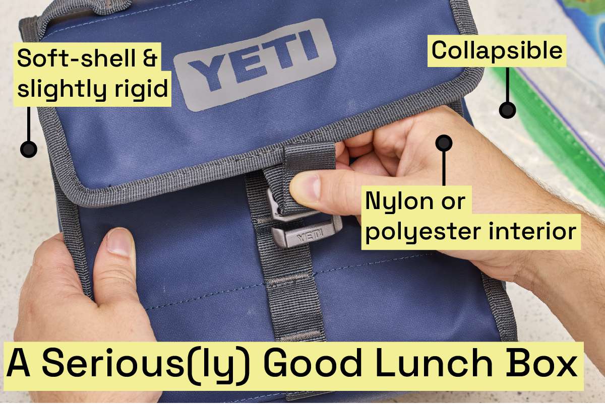 Hands latch a blue lunch box closed