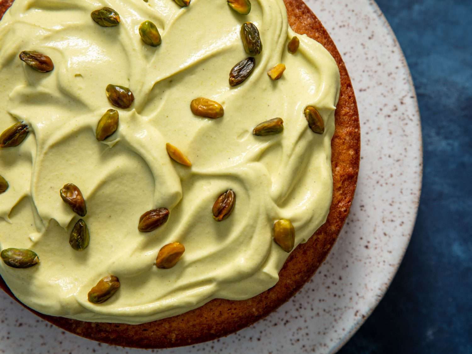 Top down view of pistachio cream on a cake.