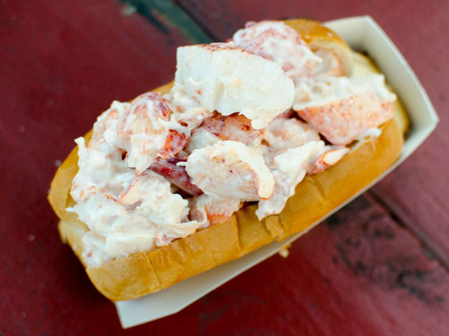 A lobster roll in a paper boat from James Hook & Company in Boston.