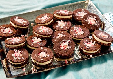 Tray of chocolate sandwich cookies topped with crushed peppermint