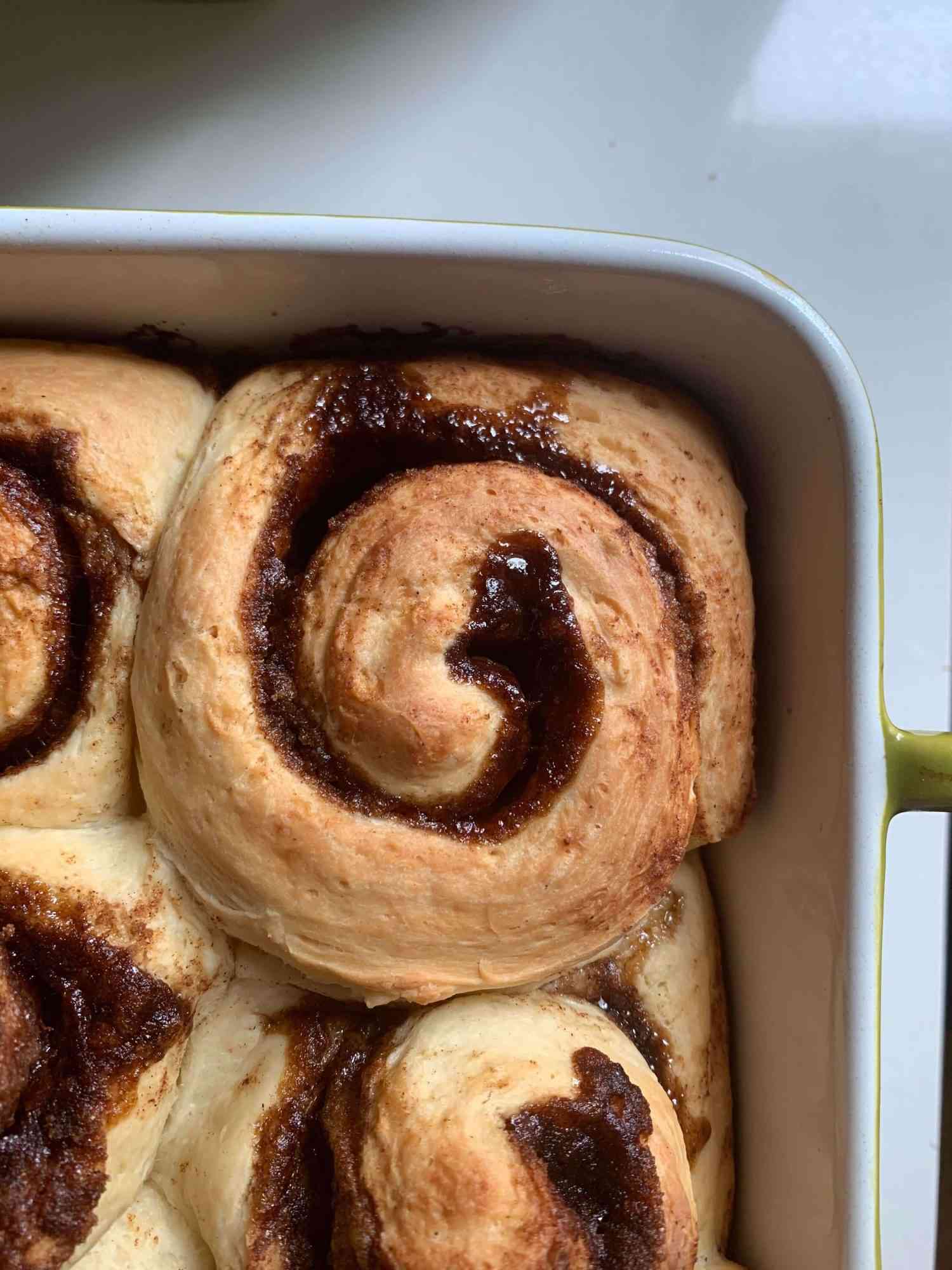 cinnamon buns in a caking dish, pre glazing