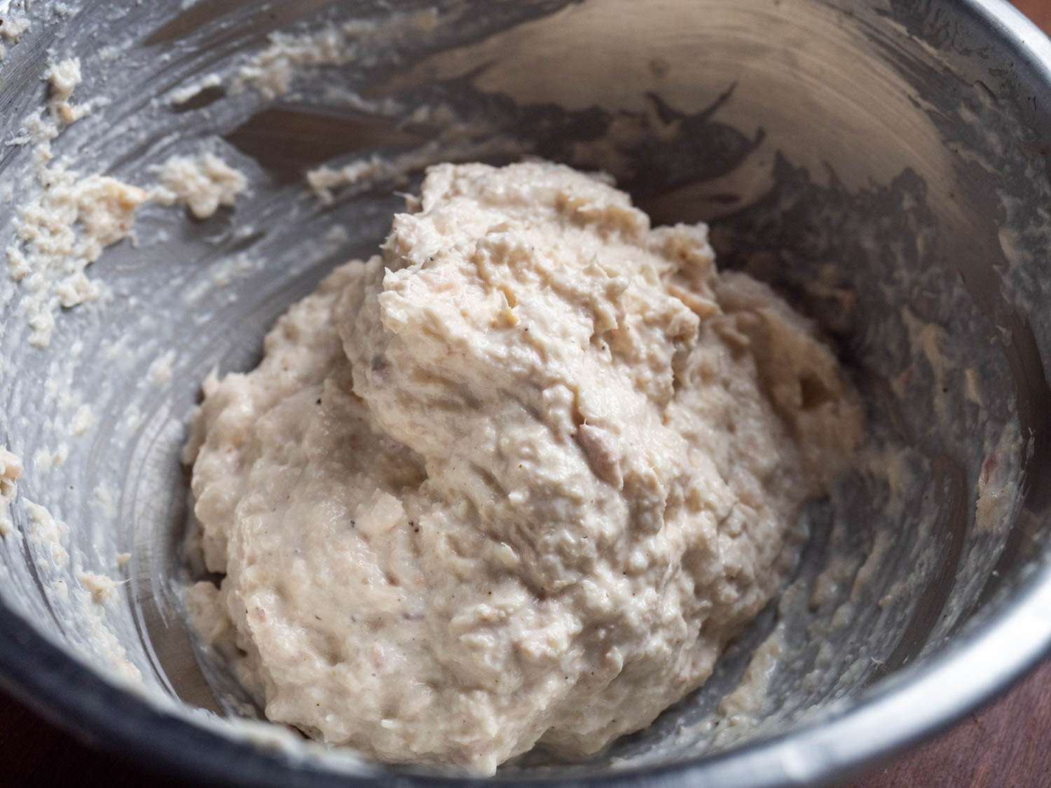Tuna salad made with panko is light and fluffy, but not runny, as seen by the whipped-cream-like mound of it in a mixing bowl in this photo
