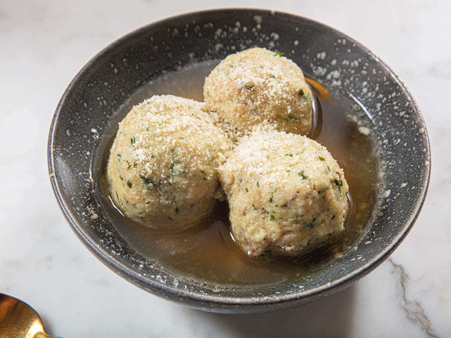 side view of Canederli in broth