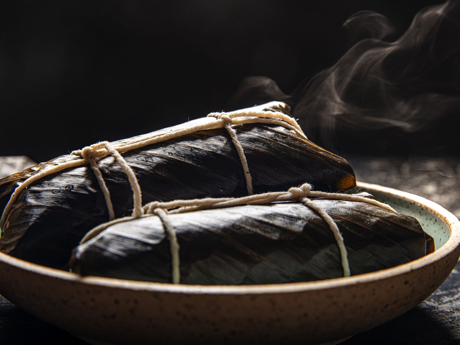 Side angle view of steam coming off of Suman