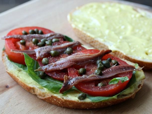 Anchovy, basil, and tomato sandwiches with aioli.