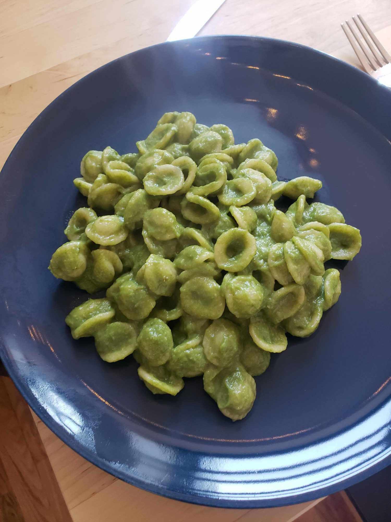Bowl of orecciete with creamy spring vegetable sauce