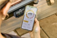 A smartphone is used to control the temperature inside the Ooni Karu 2 Pro Multi-Fuel Pizza Oven