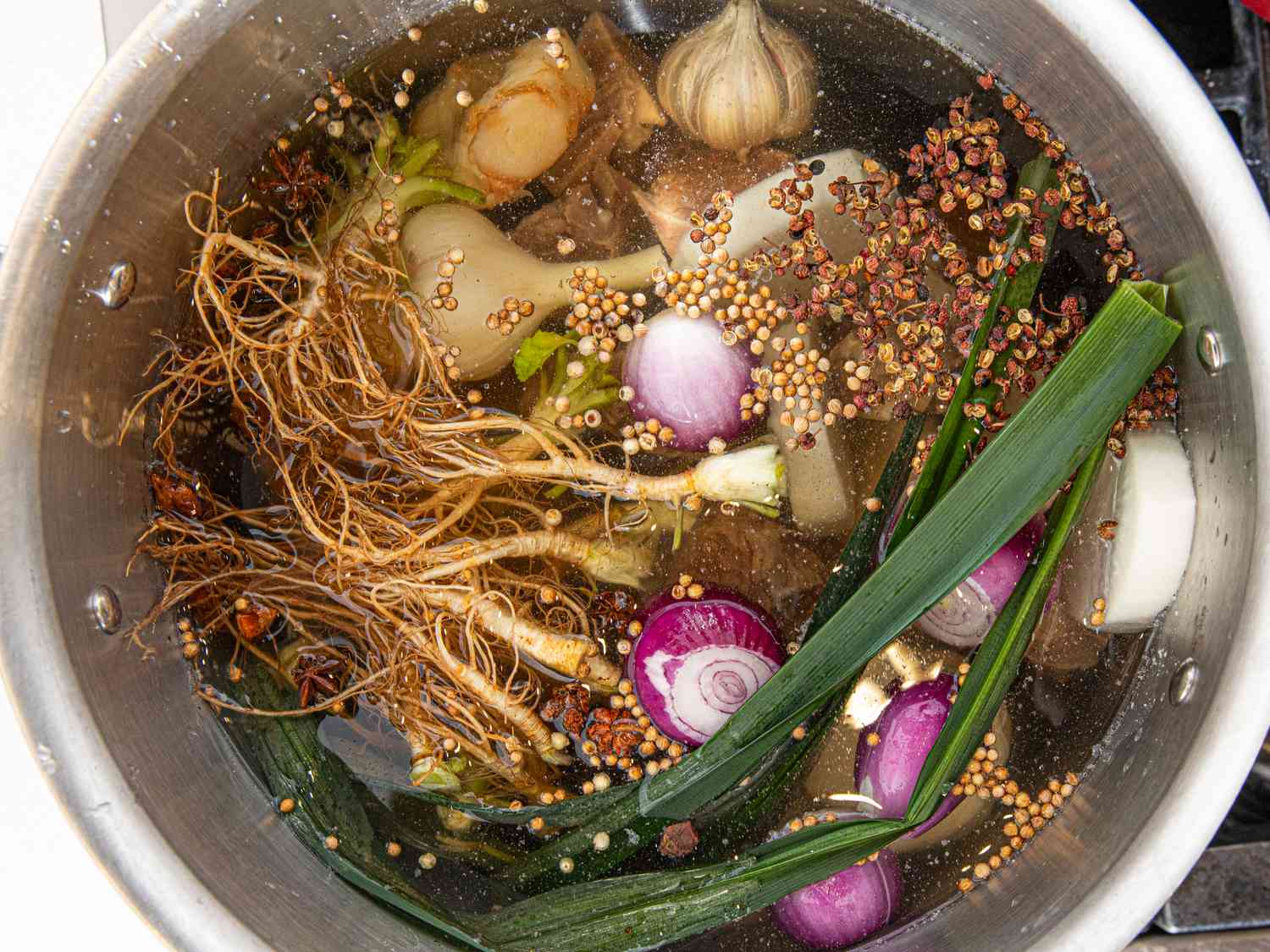 Overhead view of aromatics in pot