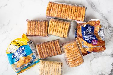 A variety of frozen hash brown products arranged on a marble surface