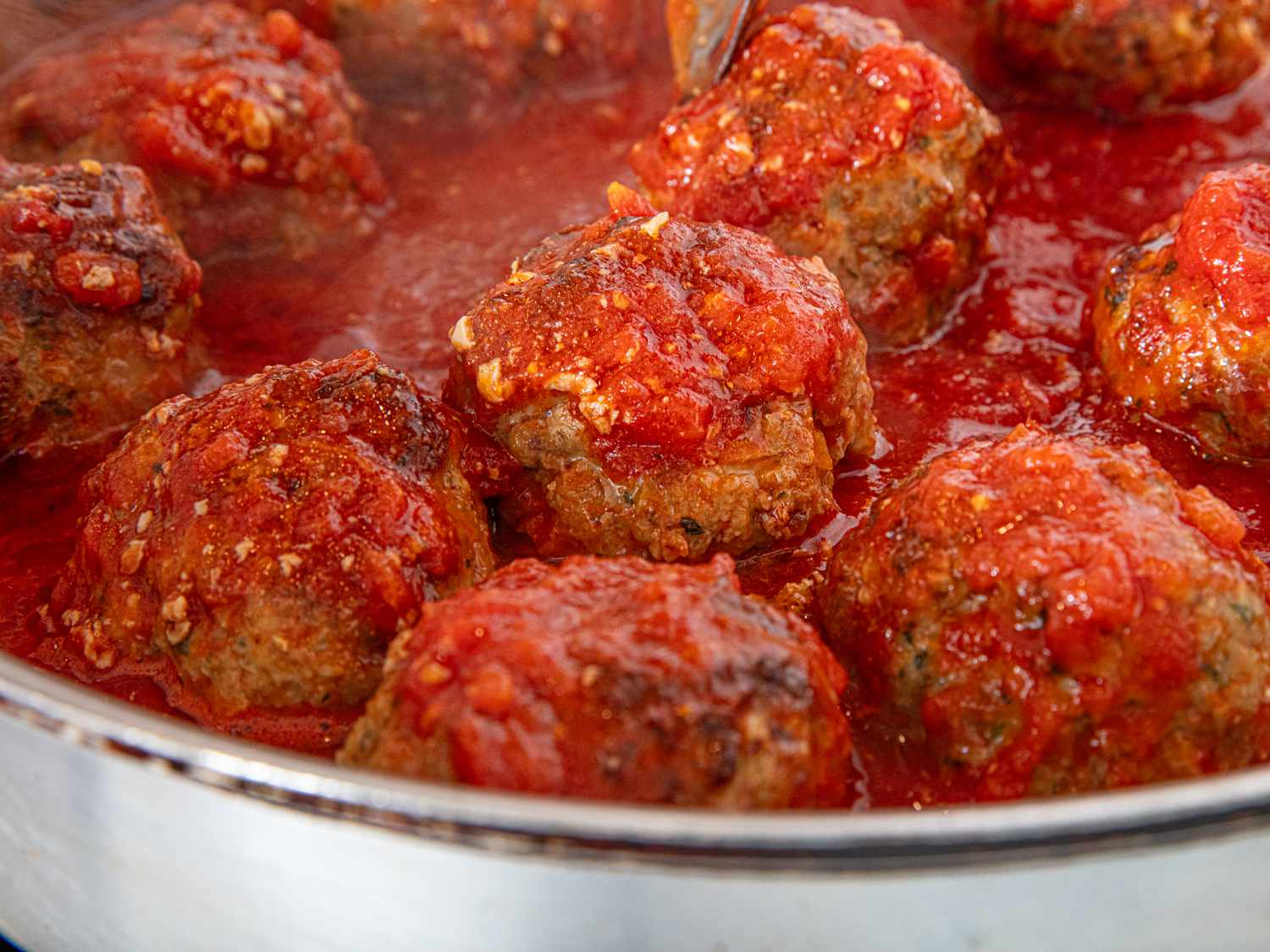 Side view of meatballs in pan