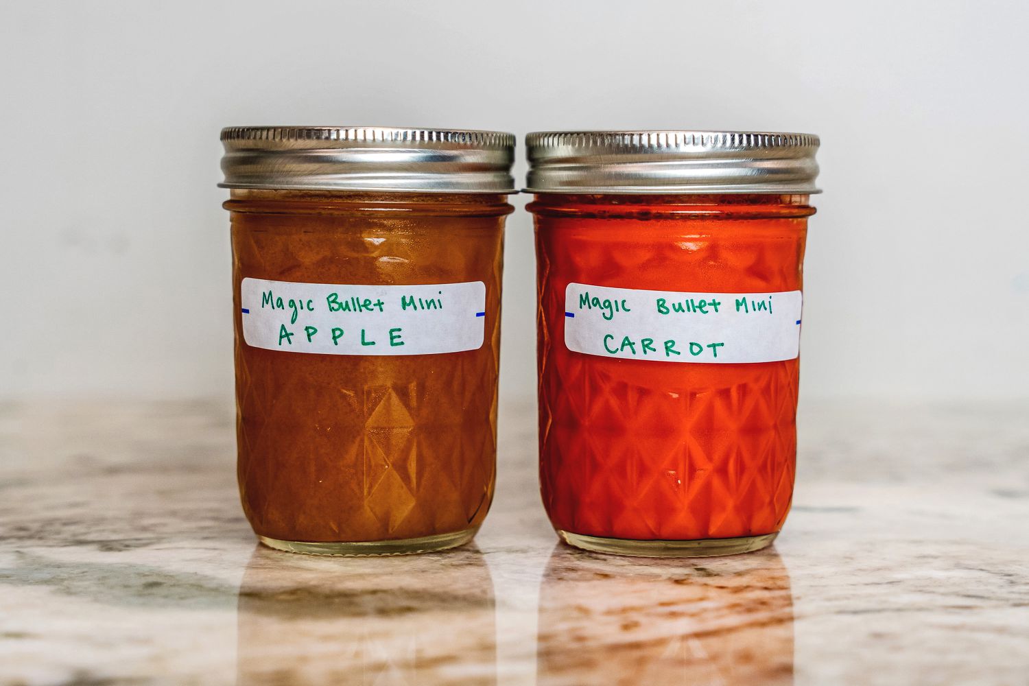 Two mason jars of juice