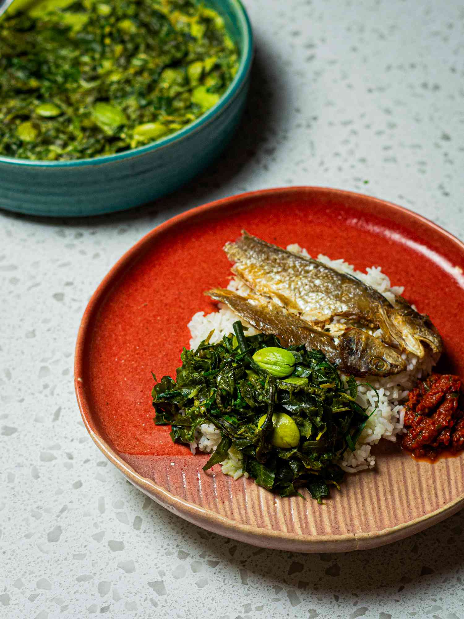 Fiddleheads and favas on rice with grilled fish and sambal.