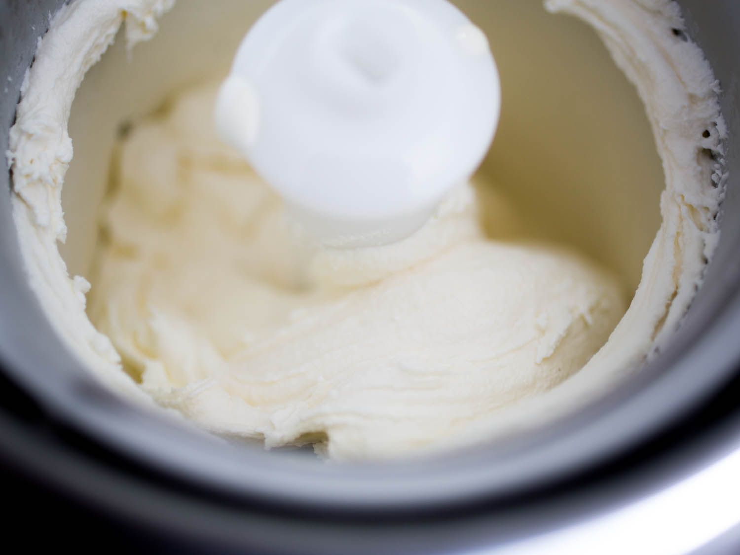 Freshly churned Philadelphia-style ice cream in an ice cream maker.