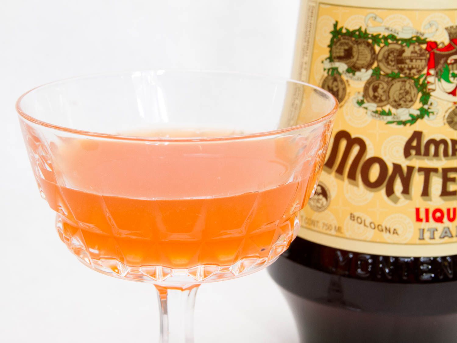 Closeup of an Adriatique cocktail served in a coupe glass.