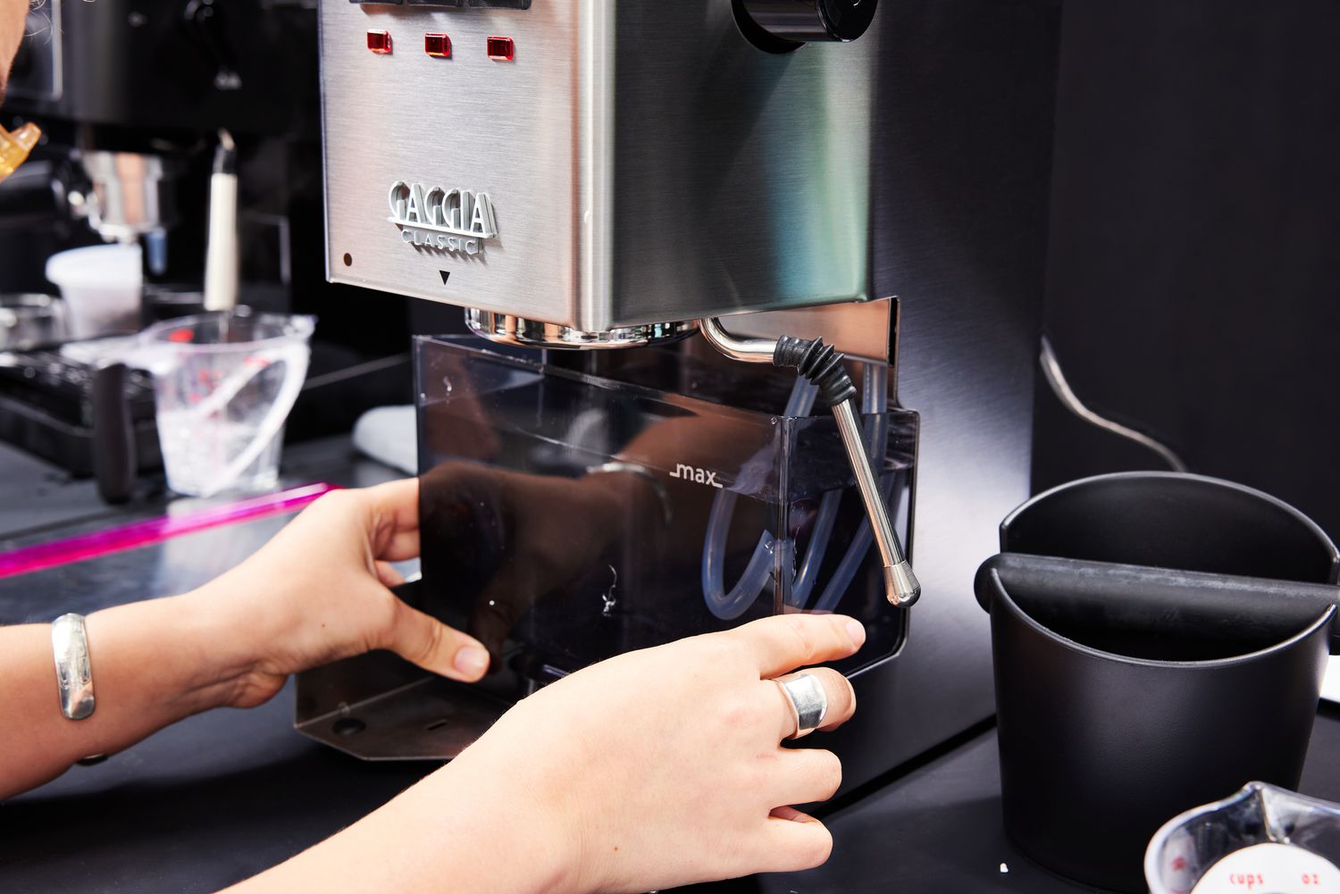 A person adjusting the Gaggia Classic Pro Espresso Machine