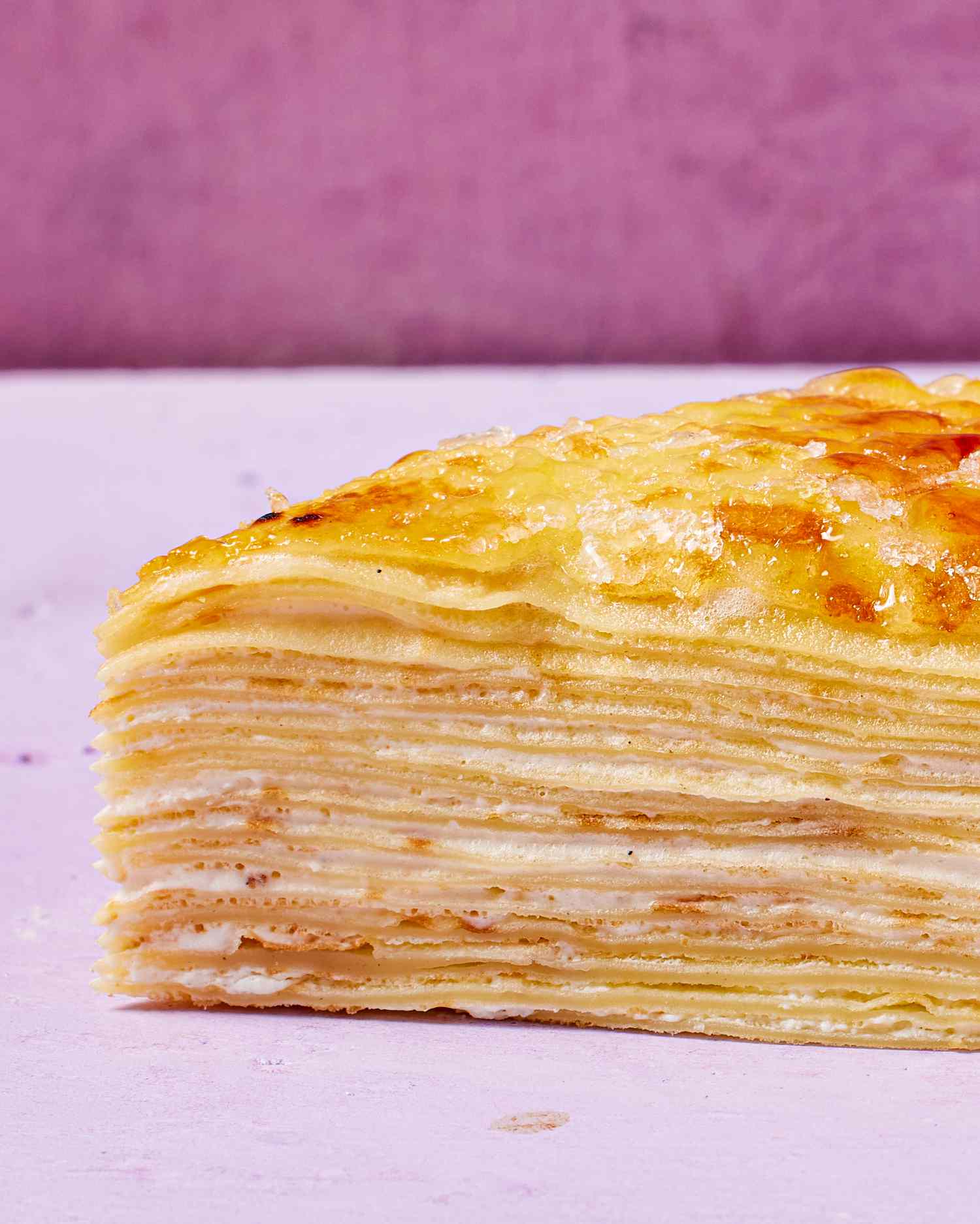 Side view closeup of a slice of crepe cake.