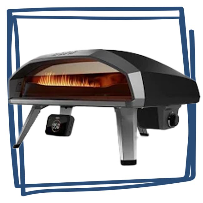 Portable outdoor pizza oven with a burning flame inside