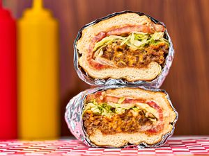 Chopped cheese sandwich stacked on top of one another.