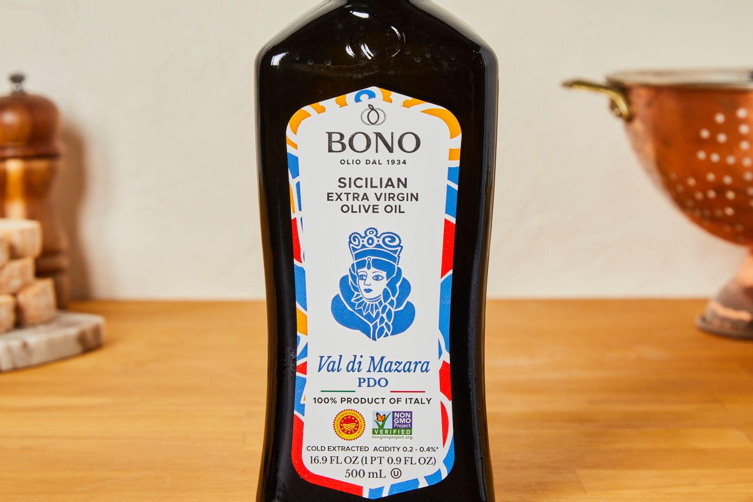 A bottle of Bono olive oil on a kitchen countertop.