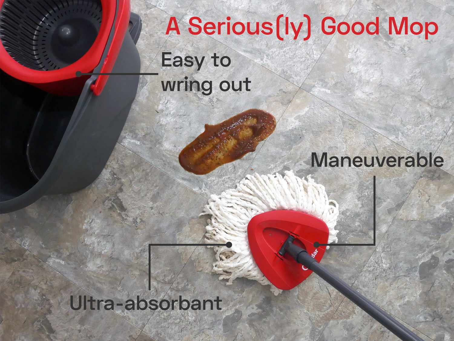 the o cedar wetmop with a smear of barbecue sauce on the floor and the wringing bucket in the left hand corner