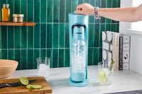 Water being carbonated with the Drinkmate soda maker.